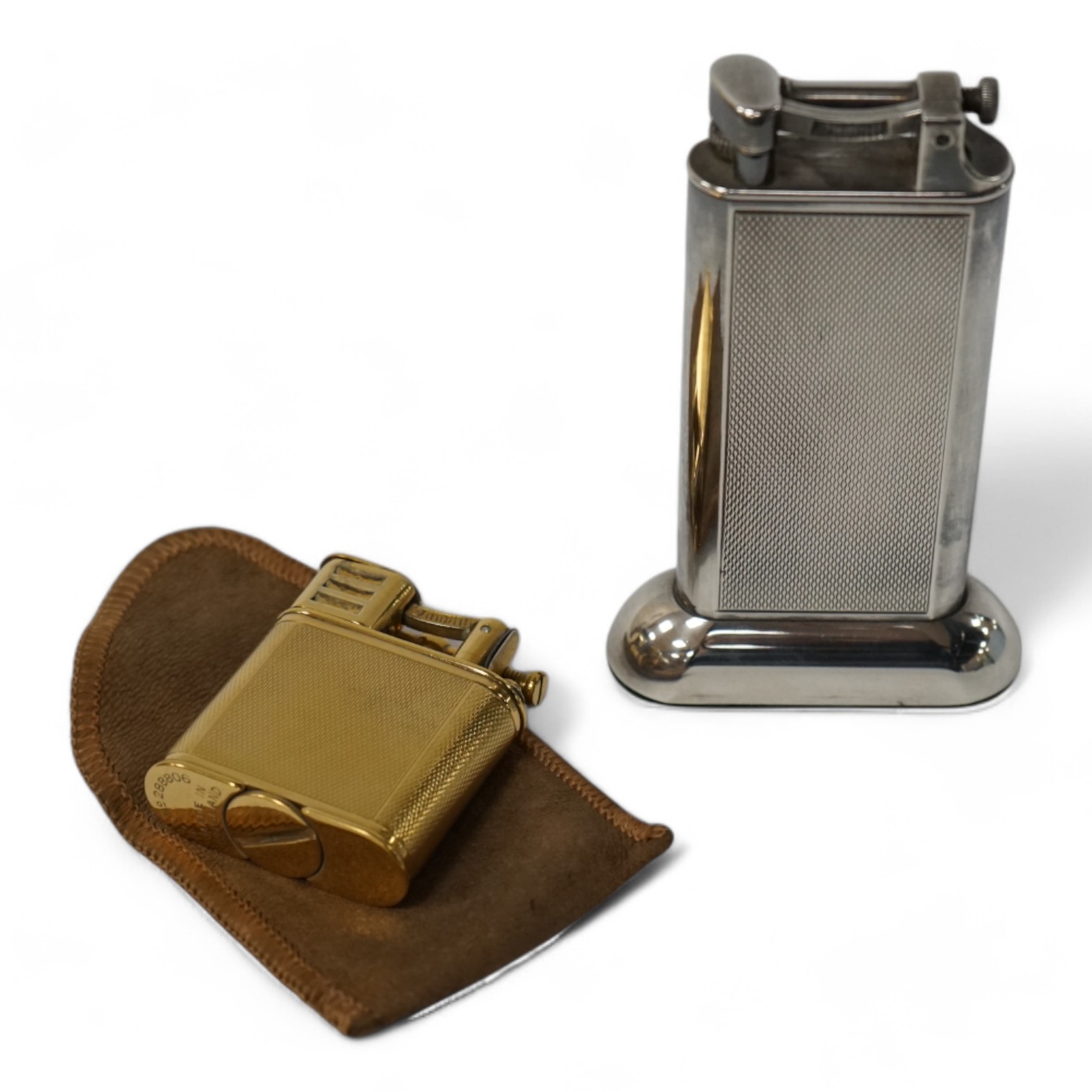 Two Dunhill lighters to include a plated table lighter, largest 10cm high. Condition - fair to good, not working